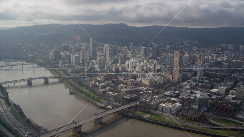 Three bridges spanning the Willamette River and skyscrapers in Downtown Portland, Oregon Aerial Stock Photo AX153_122.0000253F | Axiom Images