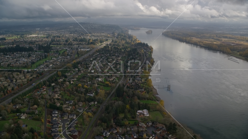 Suburban riverfront houses by Highway 14 in Vancouver, Washington Aerial Stock Photo AX153_141.0000021F | Axiom Images