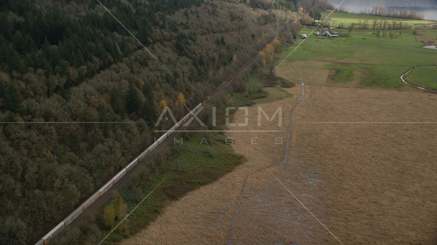 A train traveling past open farm fields in Washougal, Washington Aerial Stock Photo AX153_179.0000000F | Axiom Images