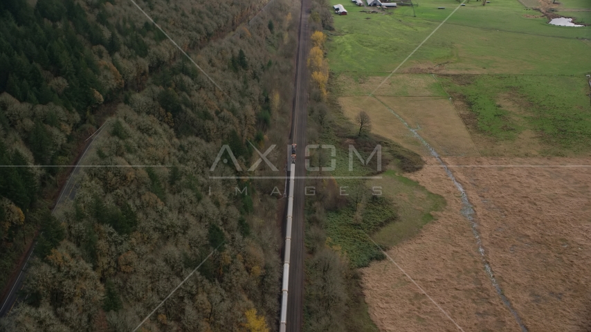 A train traveling past open fields in Washougal, Washington Aerial Stock Photo AX153_179.0000261F | Axiom Images