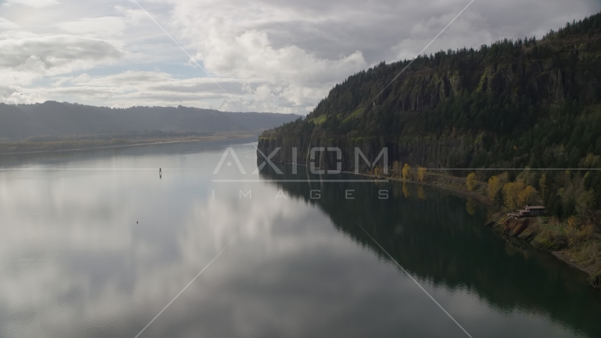 Isolated home beside the river in Columbia River Gorge, Washington Aerial Stock Photo AX154_008.0000000F | Axiom Images