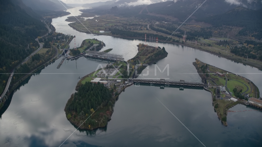 The Bonneville Dam and the Columbia River in the Columbia River Gorge Aerial Stock Photo AX154_034.0000246F | Axiom Images