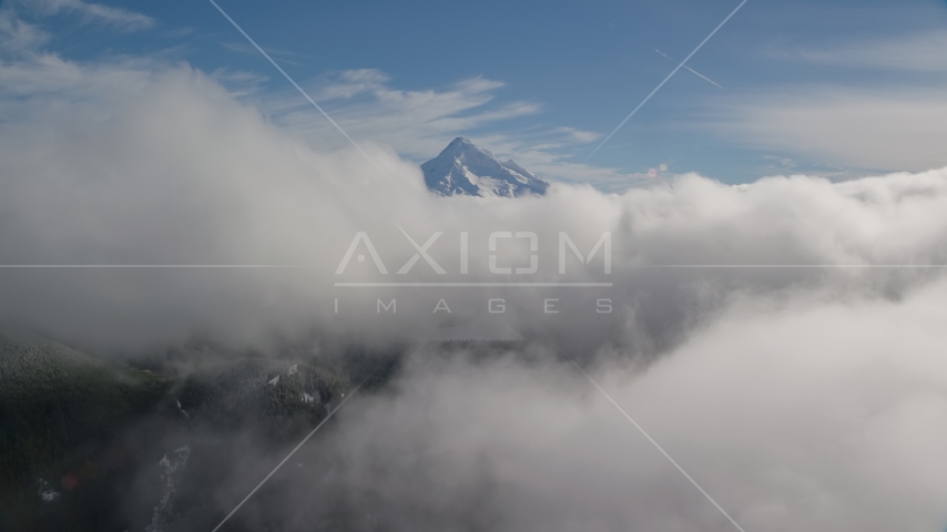 Mount Hood, visible above a layer of thick clouds, Cascade Range, Oregon Aerial Stock Photo AX154_060.0000000F | Axiom Images