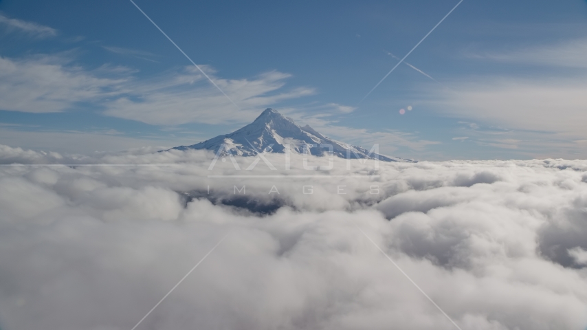 Snowy summit of Mount Hood above the clouds, Cascade Range, Oregon Aerial Stock Photo AX154_065.0000000F | Axiom Images