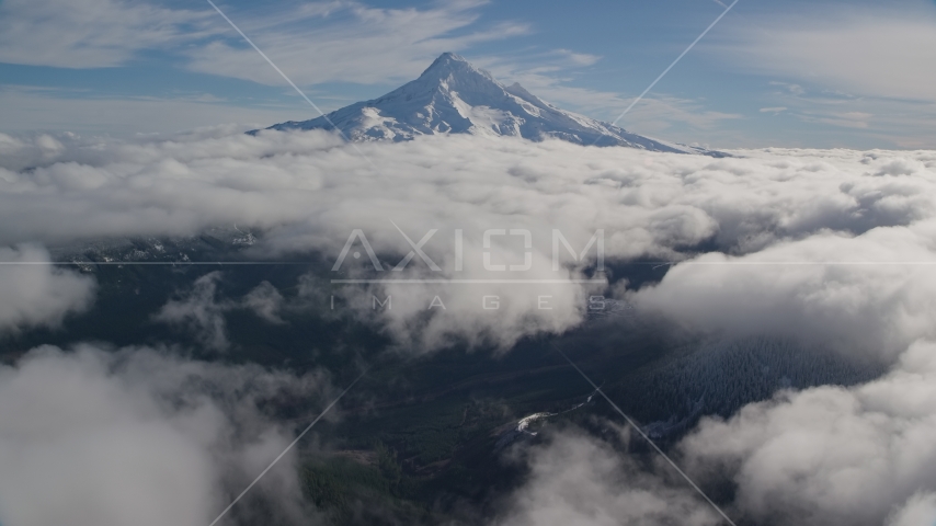 A break in the clouds near the snowy summit of Mount Hood, Cascade Range, Oregon Aerial Stock Photo AX154_068.0000206F | Axiom Images
