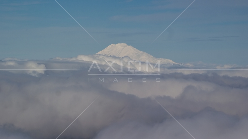 Mt Adams' snowy summit in the distance and low cloud cover, Cascade Range, Oregon Aerial Stock Photo AX154_069.0000000F | Axiom Images