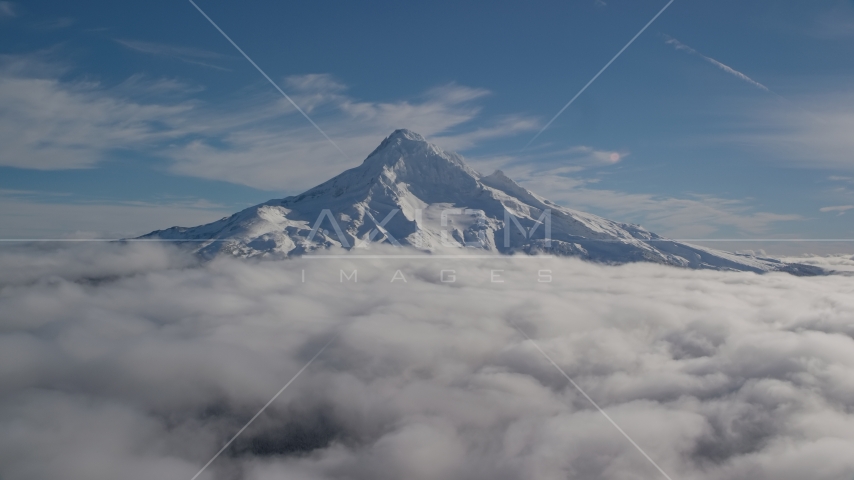 Mount Hood's snowy summit with low clouds, Mount Hood, Cascade Range, Oregon Aerial Stock Photo AX154_070.0000206F | Axiom Images
