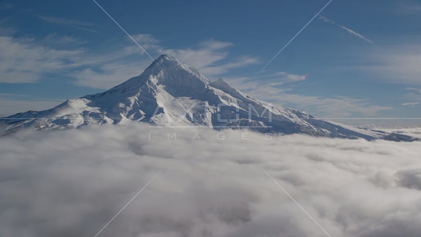 The Mount Hood summit with snow and low clouds, Mount Hood, Cascade Range, Oregon Aerial Stock Photo AX154_072.0000320F | Axiom Images