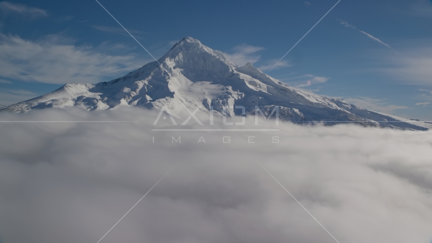 The Mount Hood summit with snow and low clouds, Cascade Range, Oregon Aerial Stock Photo AX154_074.0000339F | Axiom Images
