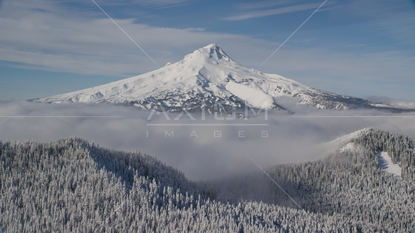 Low clouds and snowy forest at the base of Mount Hood, Cascade Range, Oregon Aerial Stock Photo AX154_111.0000000F | Axiom Images