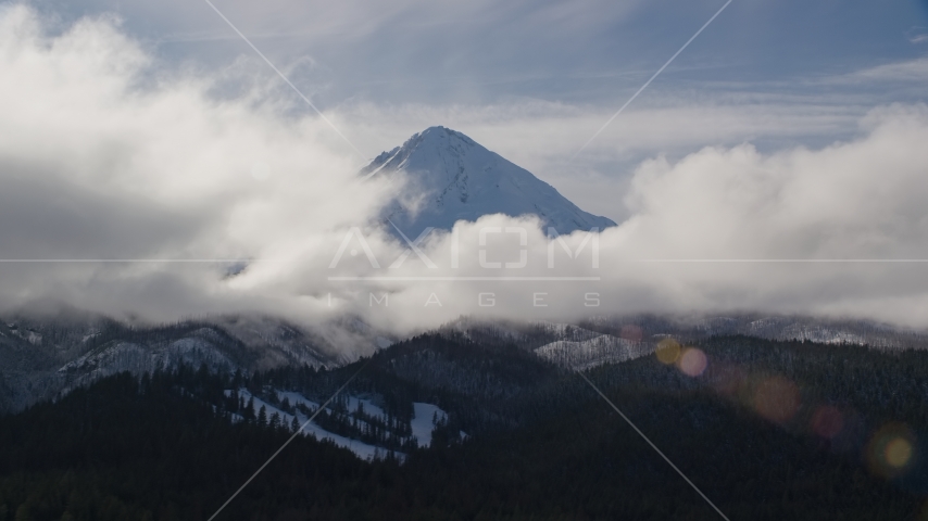 Clouds around the snowy summit of Mount Hood, Cascade Range, Oregon Aerial Stock Photo AX154_131.0000000F | Axiom Images