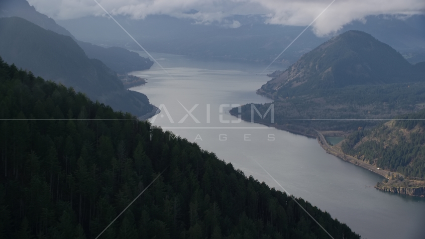 An evergreen forest mountain overlooking the Columbia River Gorge, Hood River County, Oregon Aerial Stock Photo AX154_154.0000255F | Axiom Images