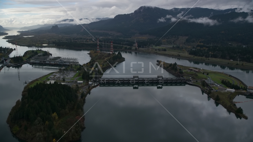The Bonneville Dam structures on the Columbia River in the Columbia River Gorge Aerial Stock Photo AX154_177.0000071F | Axiom Images