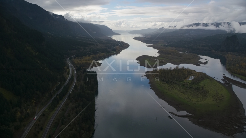 Columbia River and the I-84 highway by islands in the Columbia River Gorge Aerial Stock Photo AX154_180.0000321F | Axiom Images