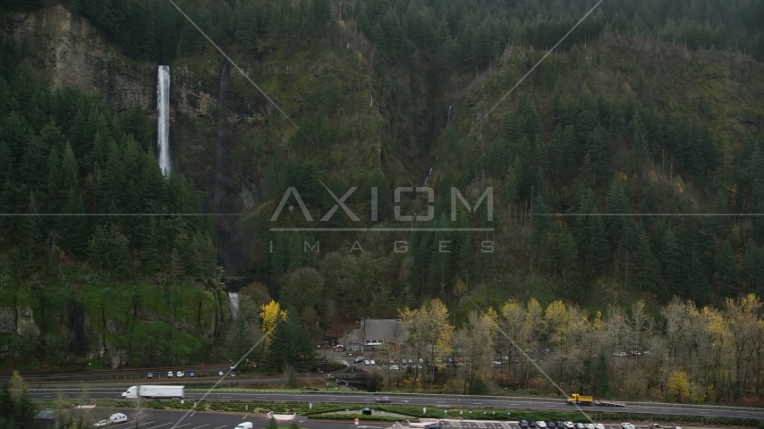 The I-84 highway below Multnomah Falls on a cliff face of the Columbia River Gorge Aerial Stock Photo AX154_189.0000235F | Axiom Images