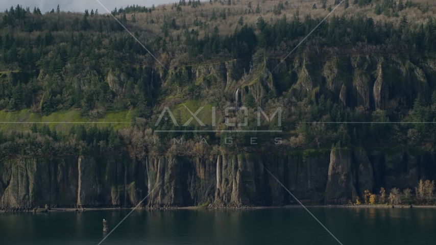 Waterfalls and steep green cliffs on the Washington side of Columbia River Gorge Aerial Stock Photo AX154_193.0000000F | Axiom Images