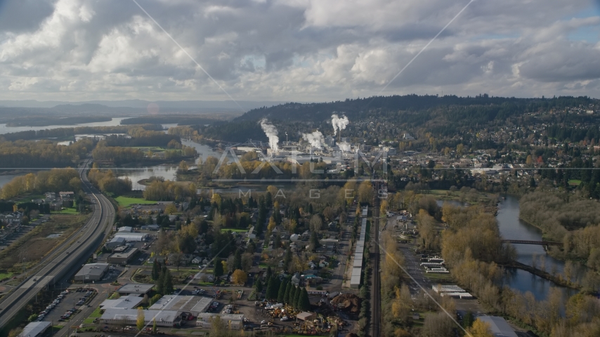 Homes near the Washougal River and the Georgia Pacific Paper Mill in Camas, Washington Aerial Stock Photo AX154_210.0000271F | Axiom Images