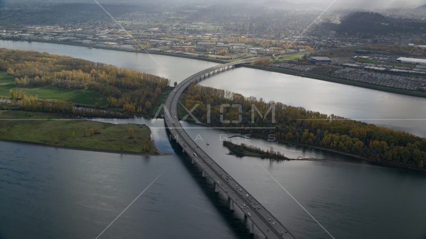 I-205 Bridge and the Columbia River with godrays shining down, Vancouver, Washington Aerial Stock Photo AX154_218.0000275F | Axiom Images