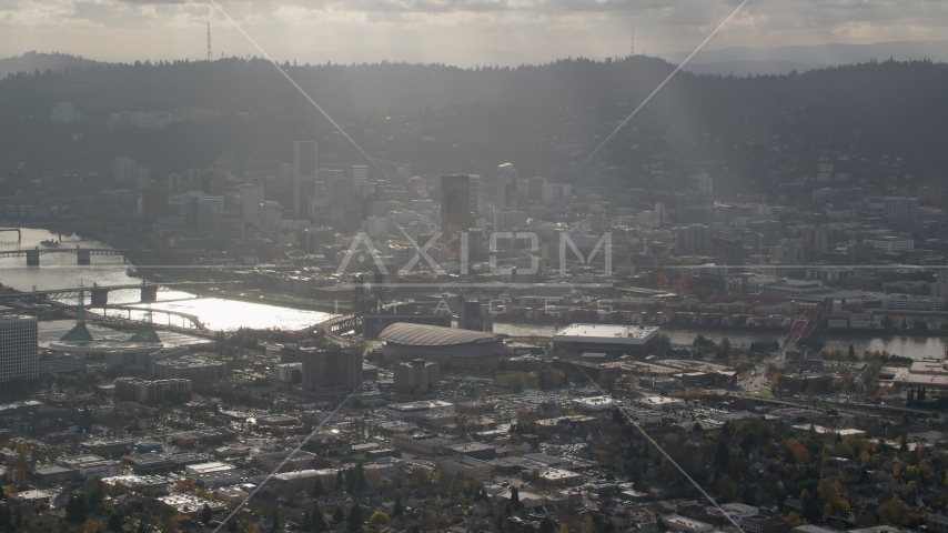 Godrays shining on Moda Center, the Willamette River and Downtown Portland, Oregon Aerial Stock Photo AX154_224.0000249F | Axiom Images