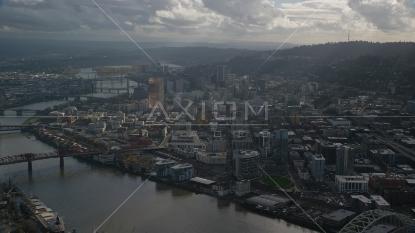 Willamette River and Downtown Portland, Oregon with godrays shining down from the clouds Aerial Stock Photo AX154_227.0000336F | Axiom Images