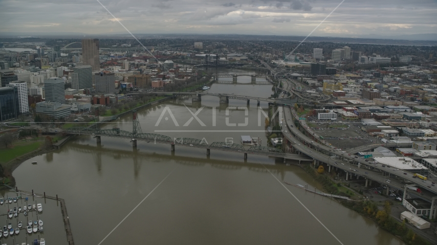 Downtown skyscrapers and Hawthorne Bridge spanning the Willamette River in Downtown Portland, Oregon Aerial Stock Photo AX155_061.0000299F | Axiom Images