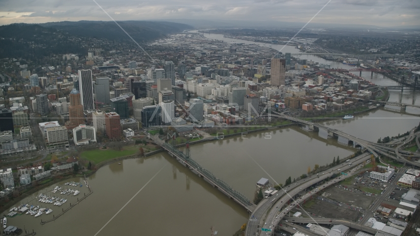 Downtown Portland cityscape and waterfront park seen from the bridges over the Willamette River in Oregon Aerial Stock Photo AX155_094.0000333F | Axiom Images