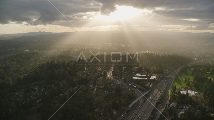 Godrays shining on neighborhoods and Highway 26, Southwest Portland, Oregon Aerial Stock Photo AX155_118.0000246F | Axiom Images