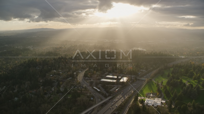 Godrays shining down on suburban neighborhoods and Highway 26, Southwest Portland, Oregon Aerial Stock Photo AX155_119.0000000F | Axiom Images