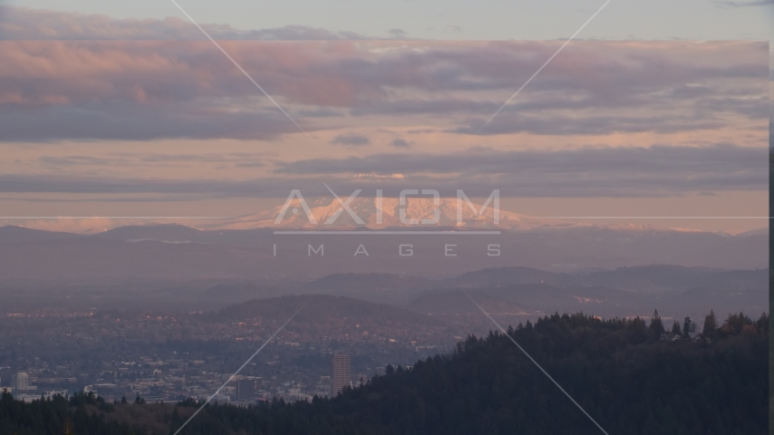 Mount Hood and Downtown Portland at sunset, seen from forest and hills in Northwest Portland, Oregon Aerial Stock Photo AX155_139.0000222F | Axiom Images