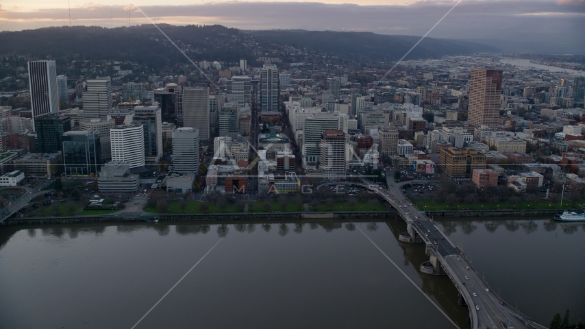 Downtown Portland skyscrapers and city park seen across the Willamette River at sunset Aerial Stock Photo AX155_153.0000340F | Axiom Images