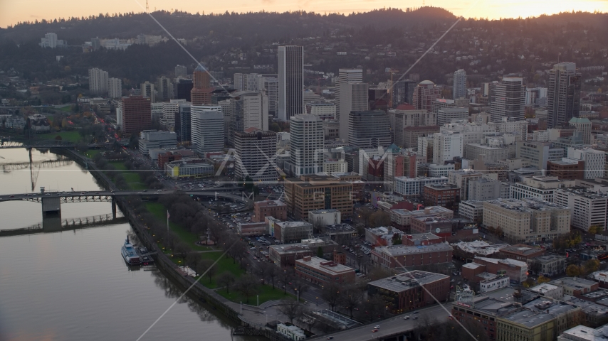 Downtown Portland skyscrapers and city park beside the Willamette River at sunset Aerial Stock Photo AX155_155.0000261F | Axiom Images