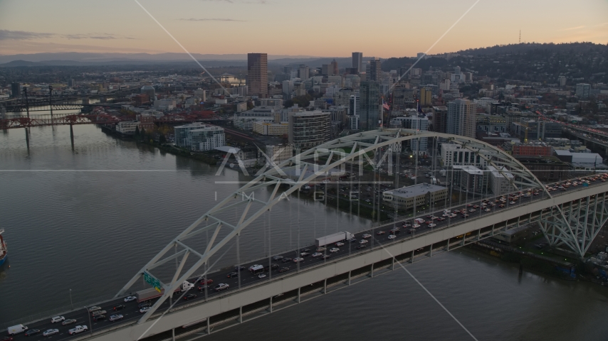 Heavy traffic crossing the Fremont Bridge at sunset, near Downtown Portland, Oregon Aerial Stock Photo AX155_159.0000302F | Axiom Images