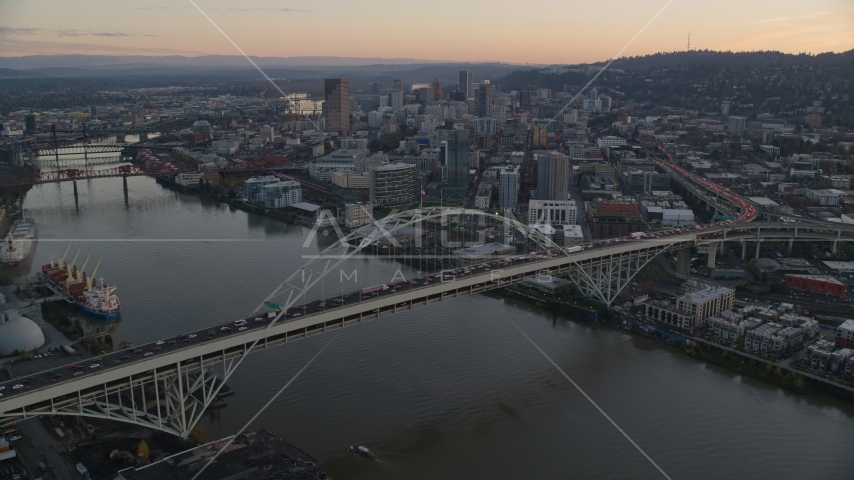 Heavy traffic on the Fremont Bridge at sunset, Downtown Portland in the background, Oregon Aerial Stock Photo AX155_161.0000000F | Axiom Images