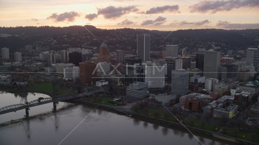 The Hawthorne Bridge, the waterfront park and Downtown Portland at sunset in Oregon Aerial Stock Photo AX155_174.0000098F | Axiom Images