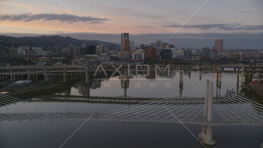 Downtown Portland skyline and Marquam Bridge seen from Tilikum Crossing at sunset, Oregon Aerial Stock Photo AX155_191.0000000F | Axiom Images