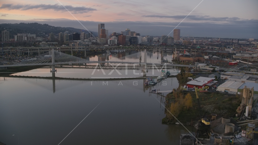 Tilikum Crossing, Marquam Bridge, and downtown skyline at sunset, Downtown Portland, Oregon Aerial Stock Photo AX155_199.0000000F | Axiom Images