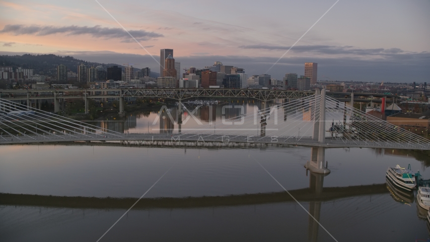 Tilikum Crossing, Marquam Bridge and downtown skyline at sunset, Downtown Portland, Oregon Aerial Stock Photo AX155_200.0000031F | Axiom Images