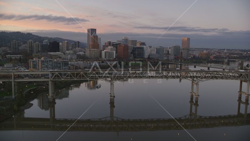 Tilikum Crossing, Marquam Bridge and downtown skyline at sunset, Downtown Portland, Oregon Aerial Stock Photo AX155_200.0000319F | Axiom Images