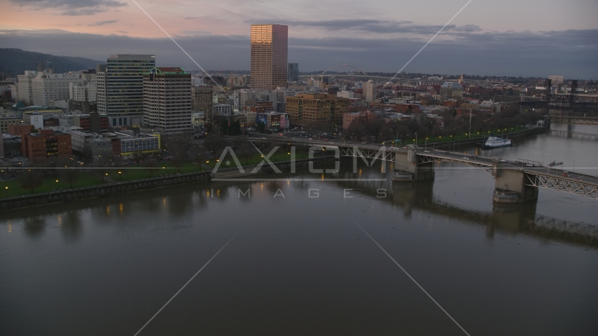 Morrison Bridge, waterfront park and downtown skyline at sunset, Downtown Portland, Oregon Aerial Stock Photo AX155_203.0000000F | Axiom Images