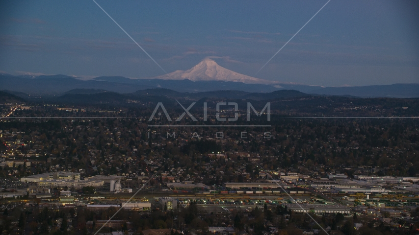 Mount Hood at sunset, seen from a train yard and neighborhoods in Southeast Portland, Oregon Aerial Stock Photo AX155_248.0000000F | Axiom Images