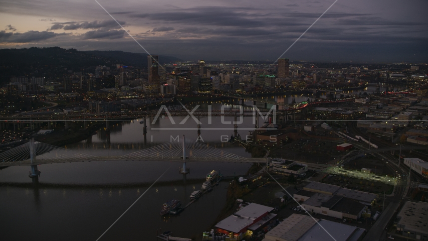 Downtown skyscrapers and bridges over the Willamette River at sunset, Downtown Portland, Oregon Aerial Stock Photo AX155_249.0000359F | Axiom Images
