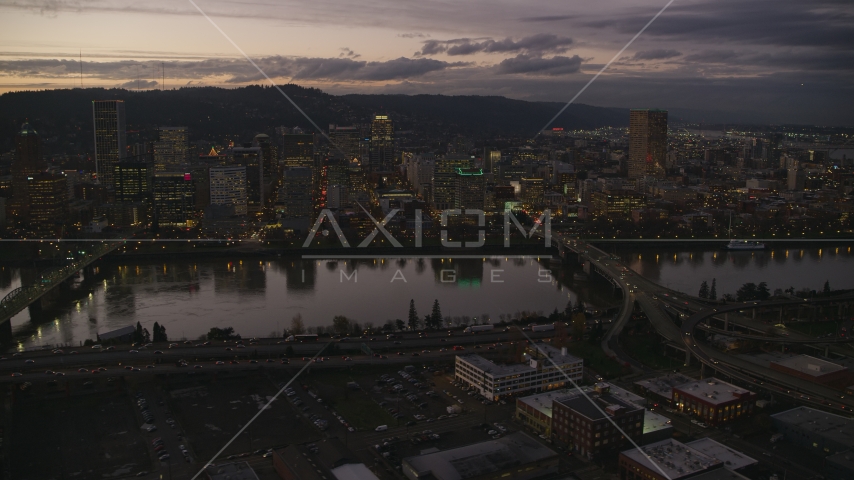Skyscrapers and bridges over the Willamette River at sunset, Downtown Portland, Oregon Aerial Stock Photo AX155_252.0000258F | Axiom Images
