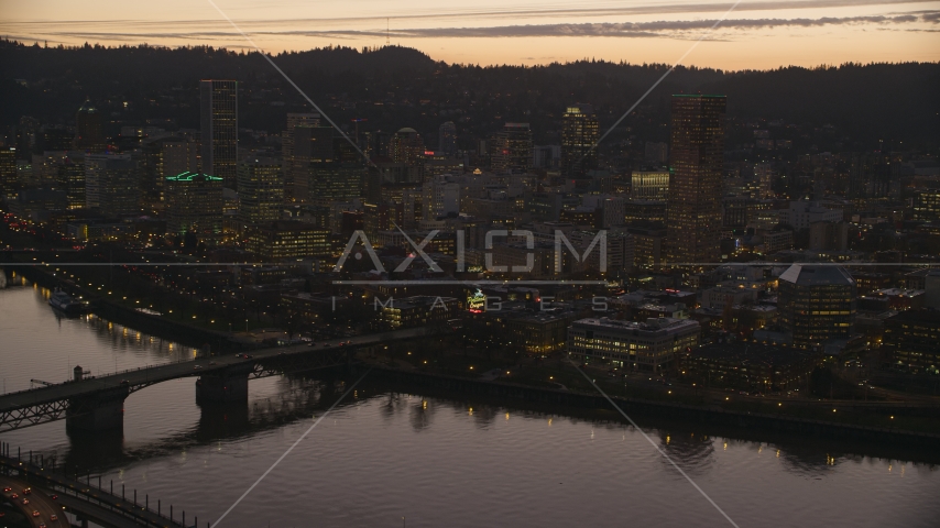 The Burnside Bridge over the Willamette River, White Stag Sign, US Bancorp Tower at sunset, Downtown Portland, Oregon Aerial Stock Photo AX155_255.0000321F | Axiom Images