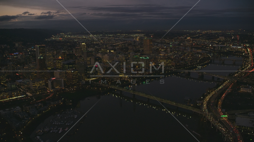 Downtown Portland's cityscape beside the Willamette River at sunset, Oregon Aerial Stock Photo AX155_268.0000248F | Axiom Images