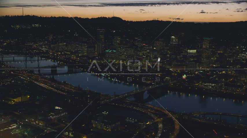 Downtown skyscrapers, Willamette River bridges, and freeway interchange at night, Downtown Portland, Oregon Aerial Stock Photo AX155_298.0000000F | Axiom Images