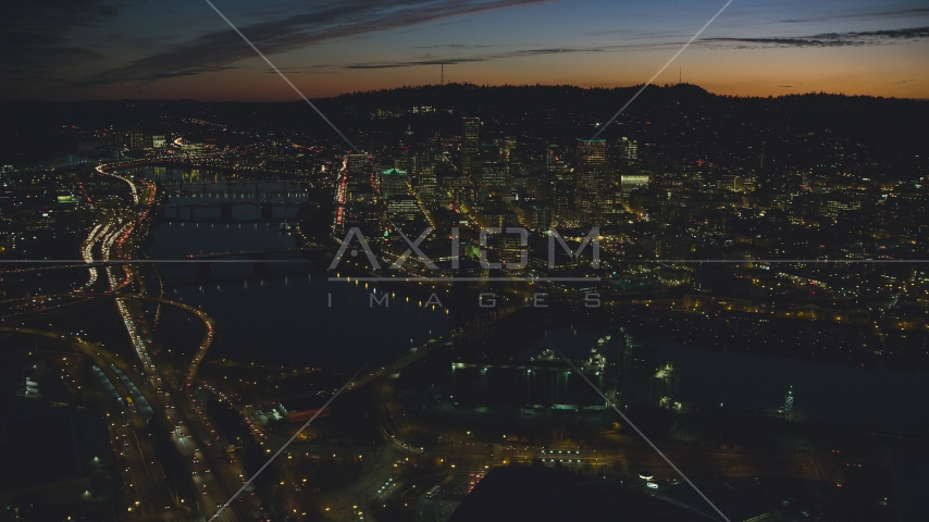 A view of Downtown Portland, Oregon, at night across the Willamette River Aerial Stock Photo AX155_314.0000000F | Axiom Images
