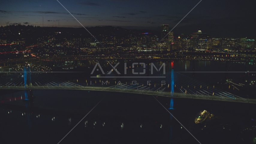 Tilikum Crossing and Marquam Bridge, with Downtown Portland skyline in the distance, Oregon, night Aerial Stock Photo AX155_324.0000003F | Axiom Images