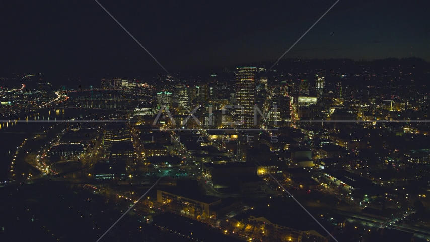 Downtown skyscrapers by bridges over the Willamette River at nighttime, Downtown Portland, Oregon Aerial Stock Photo AX155_364.0000350F | Axiom Images