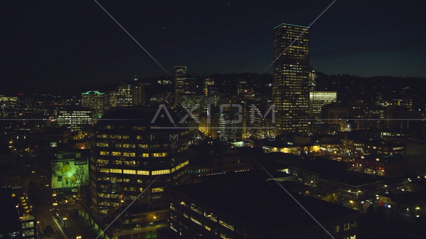 One Pacific Square, with US Bancorp Tower and high-rises in the background at night, Downtown Portland, Oregon Aerial Stock Photo AX155_368.0000040F | Axiom Images