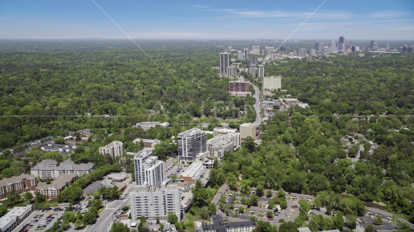 Peachtree road leading to skyscrapers and wooded area, Bulkhead, Georgia Aerial Stock Photo AX36_048.0000418F | Axiom Images